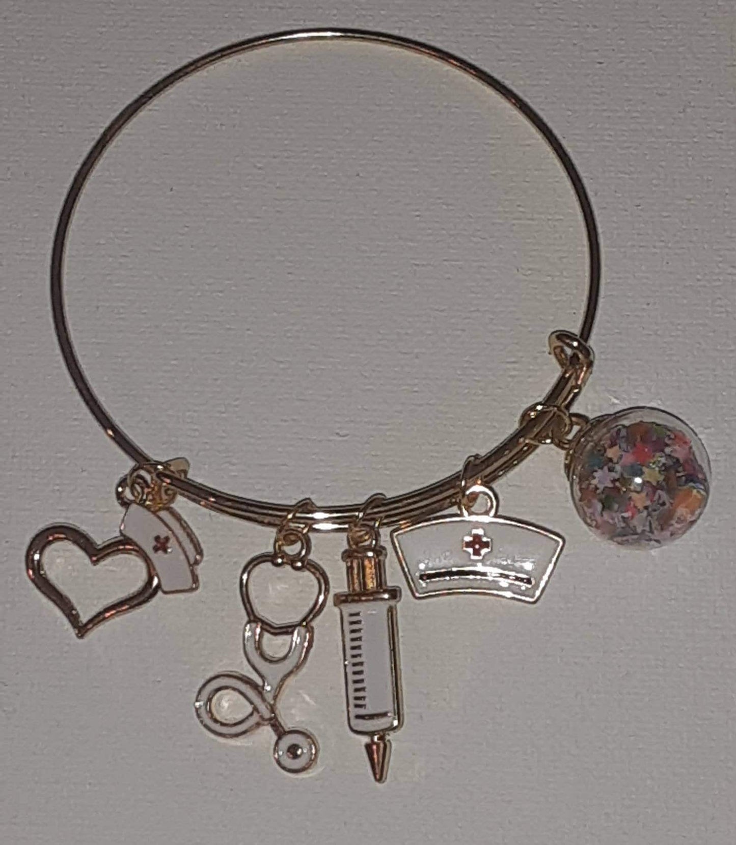 Gold expandable charm bracelet "Nurse"charms