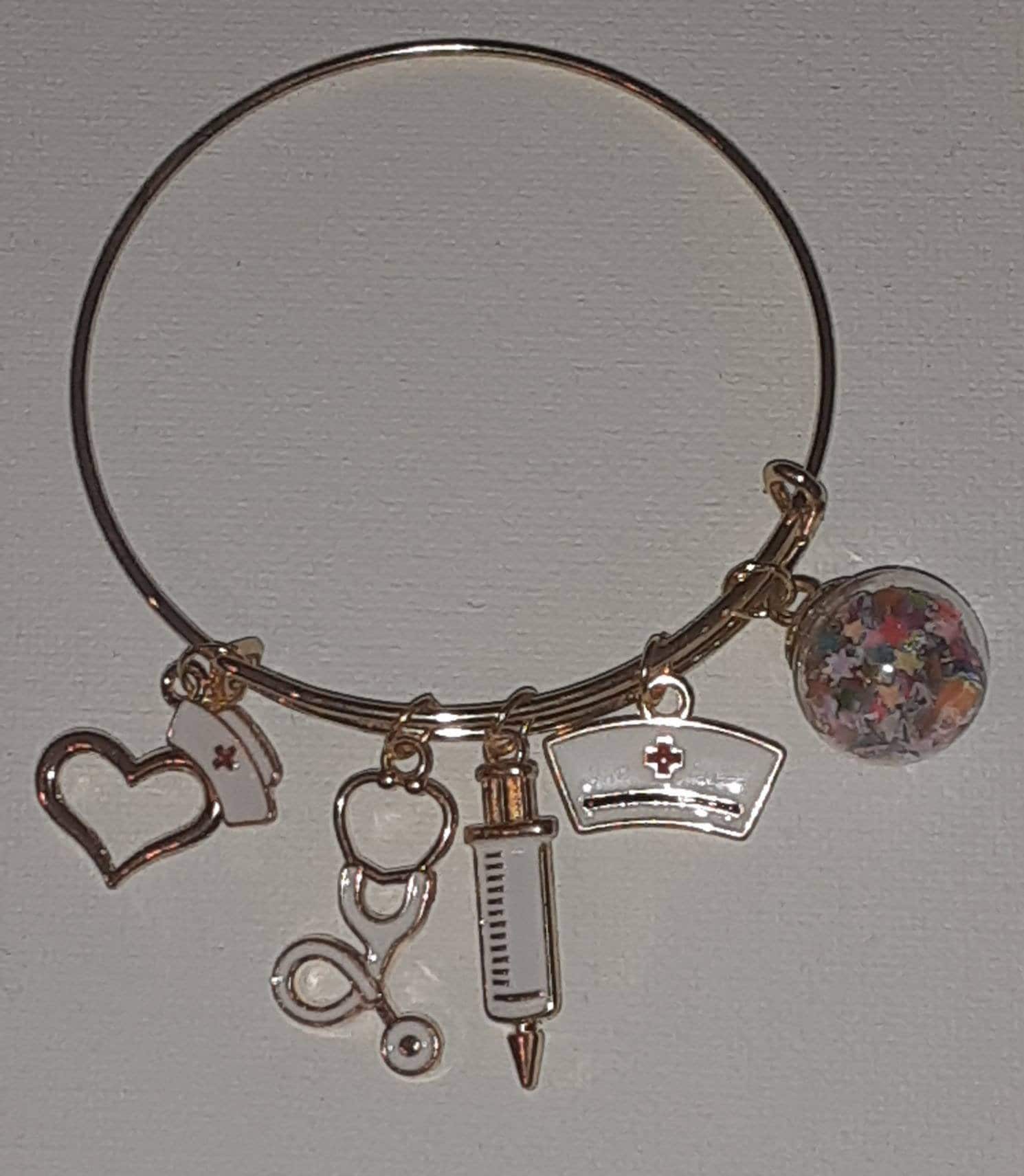 Gold expandable charm bracelet "Nurse"charms