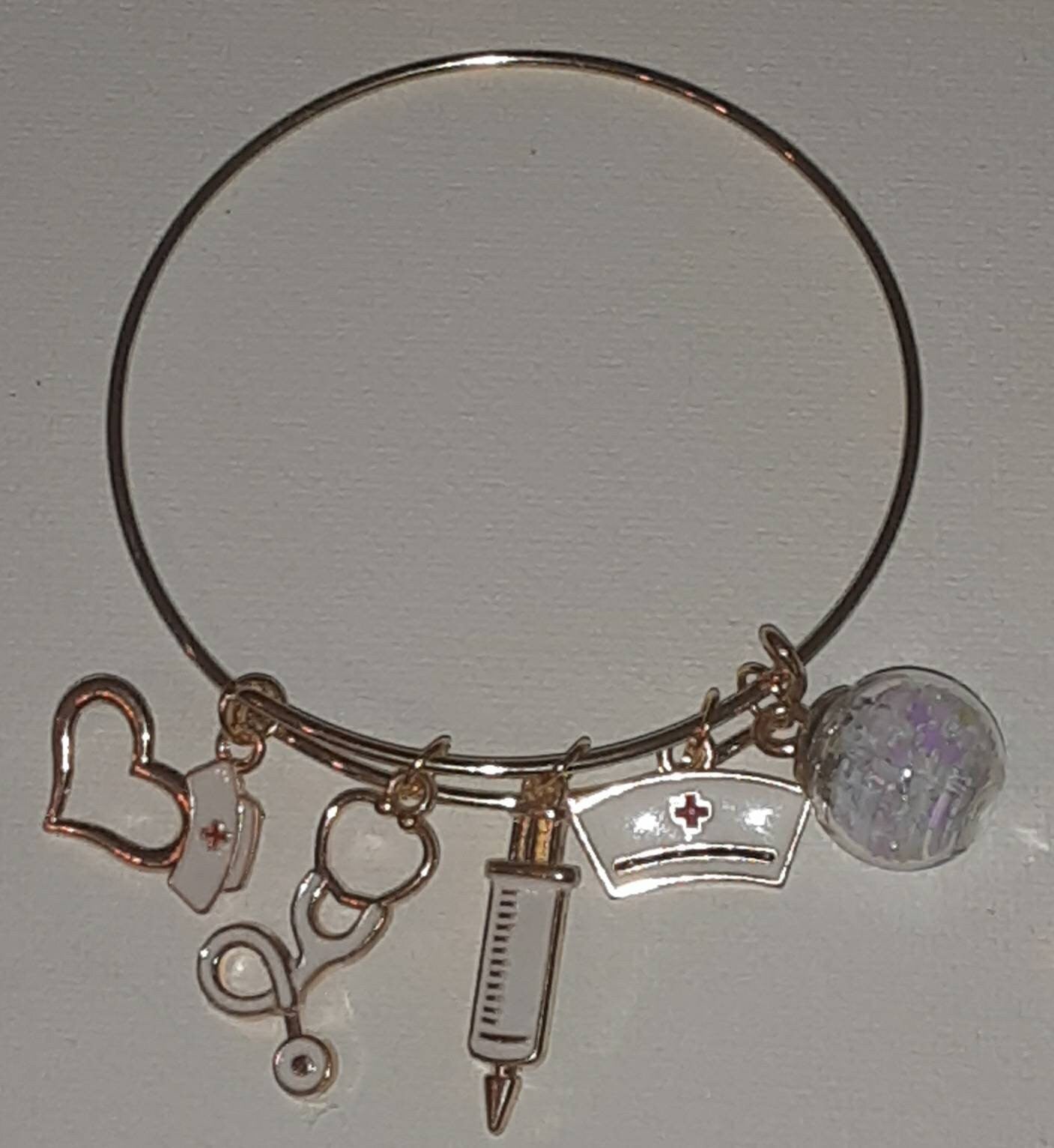 Gold expandable charm bracelet "Nurse"charms